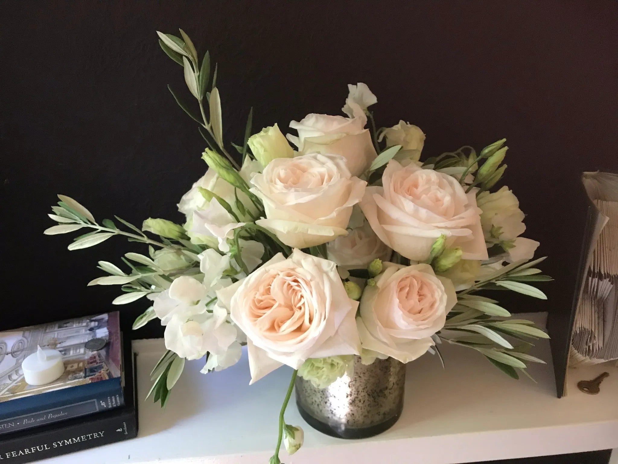 Classic Garden luxury floral arrangement with premium blush garden roses, cream lisianthus, and olive foliage styled in a metallic mercury glass vase by Nifty Package Co.